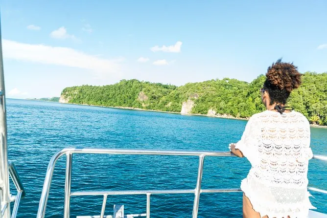 Catamaran anchored over the clear snorkeling reef at Anse Cochon on a st lucia snorkeling cruise, west coast St Lucia
